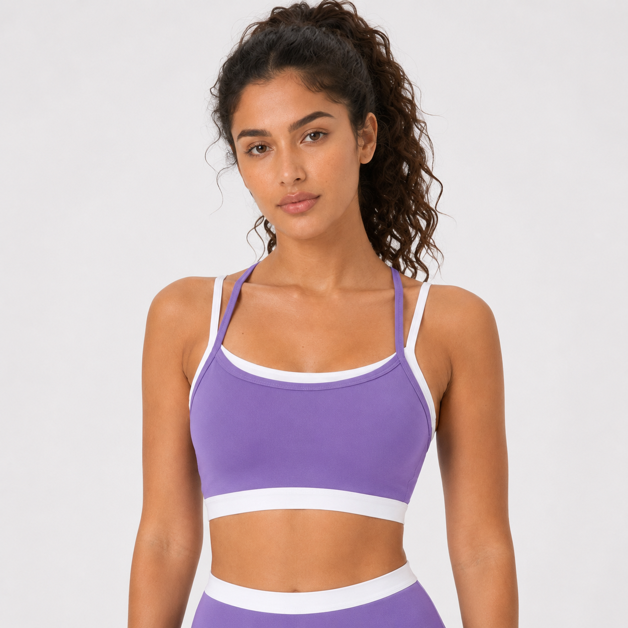 Roland violet__04_front-detail | Close-up front view of the layered sports bra in Roland Violet